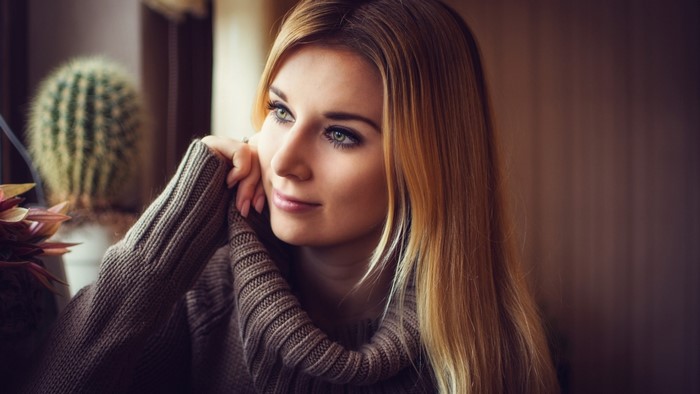 Blonde woman in a turtleneck sweater