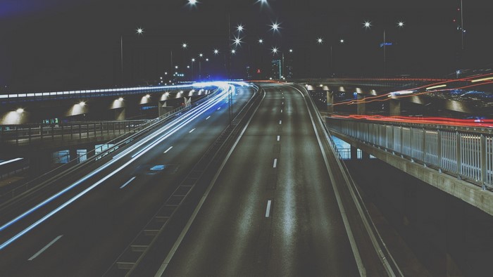 Night highway with light trails