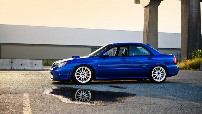 Blue Subaru WRX STI parked on asphalt