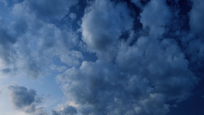 Dark clouds in a blue sky after rain