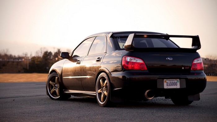 Black Subaru Impreza WRX STI with large spoiler
