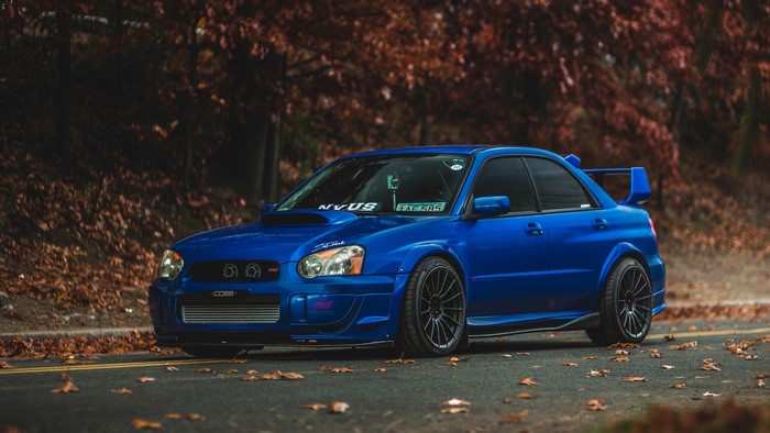 Blue Subaru Impreza STI on Autumn Road