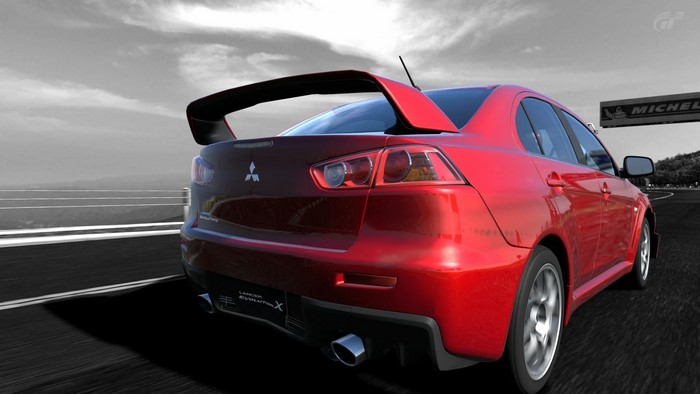 Red Mitsubishi Lancer Evolution X on a Racetrack