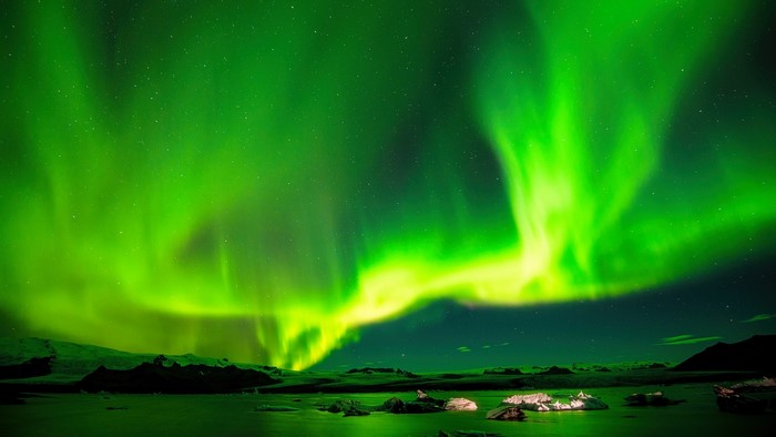 Aurora Borealis over a glacial lagoon