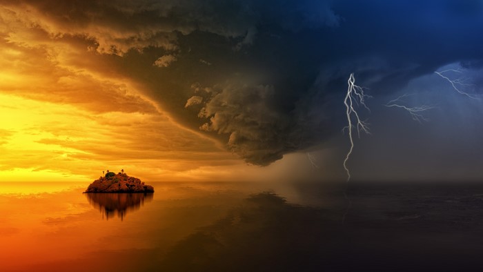 Island under a stormy sky with lightning