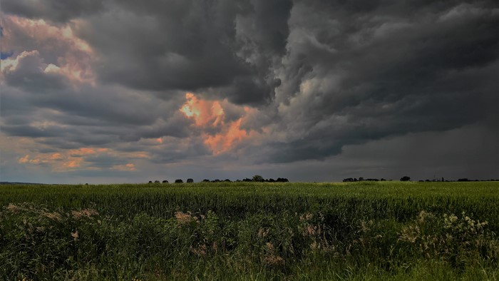 Stormy Sky Over Green Field