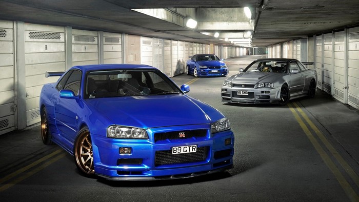 Nissan Skyline GT-R R34 cars in a garage