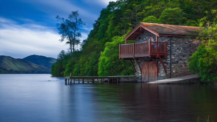 Boat house on a lake with mountains