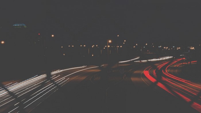 Night highway with light trails
