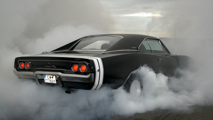 Black Dodge Charger RT doing a burnout