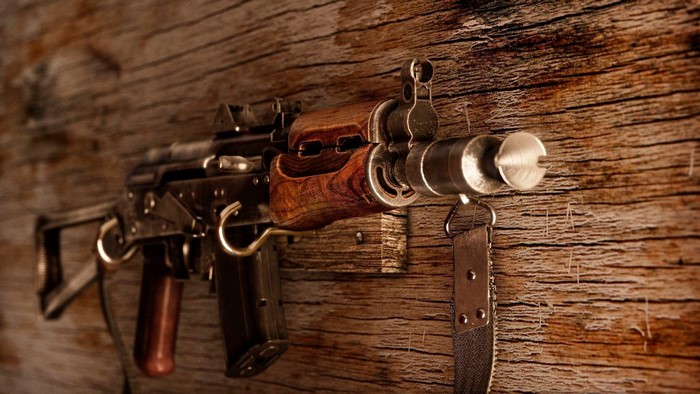 AKSU rifle with wooden furniture on a wooden background