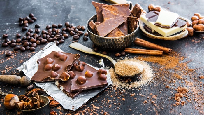 Chocolate bars with hazelnuts, coffee beans, and spices