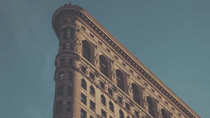 Flatiron Building against a blue sky