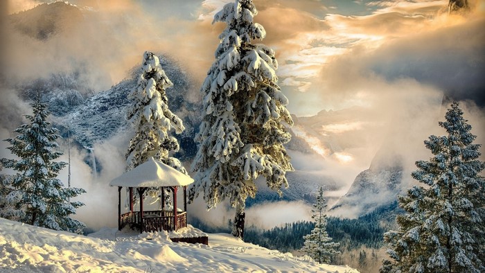 Snowy mountains with a gazebo and pine trees
