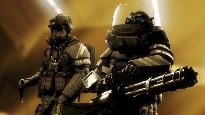 Two soldiers in tactical gear, one with a minigun