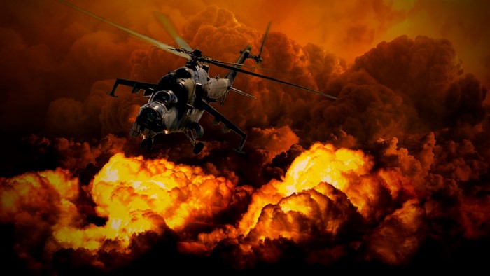 Helicopter flying through explosions and smoke