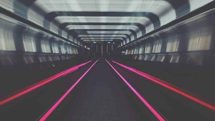 Moving walkway with pink lights