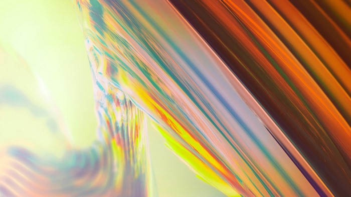 Abstract iridescent waves with orange and yellow hues