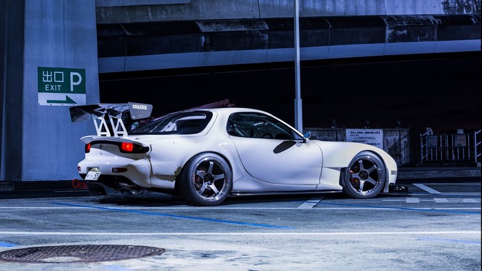 White Mazda RX-7 with large rear wing