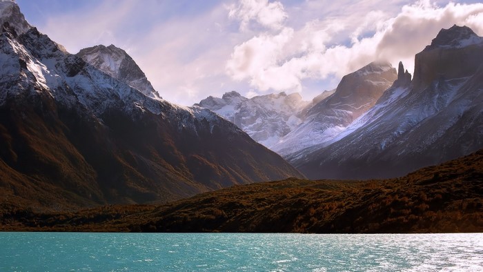 Snow-capped mountains and turquoise lake