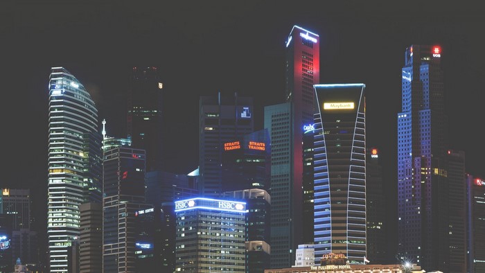 Singapore skyline at night with illuminated skyscrapers