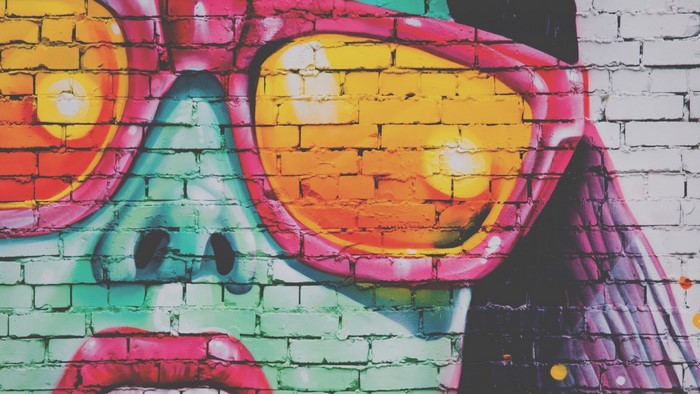 Graffiti of a person wearing large sunglasses