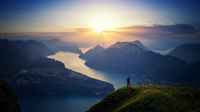 Man overlooking Lake Lucerne at sunrise