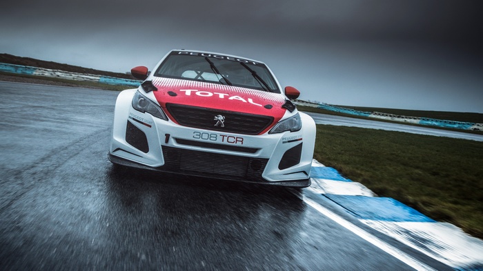 Peugeot 308 TCR race car on a wet track