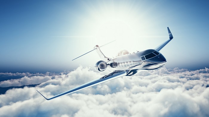 4K Learjet 45 flying above clouds