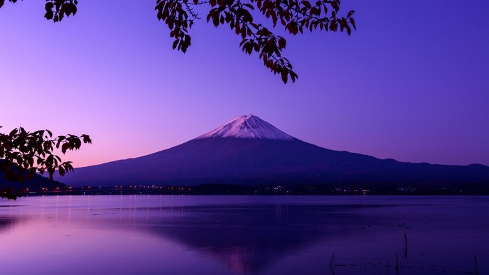 Mount Fuji at twilight over a lake