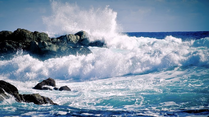 Waves crashing on rocky shore