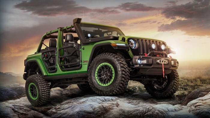 Green Jeep Wrangler Rubicon on Rocks