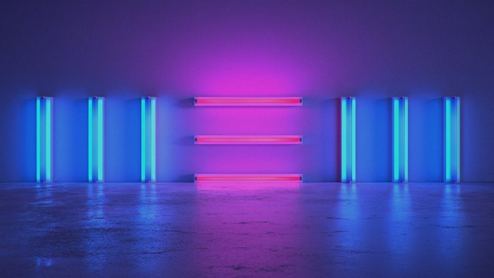 Neon lights in a room with a reflective floor