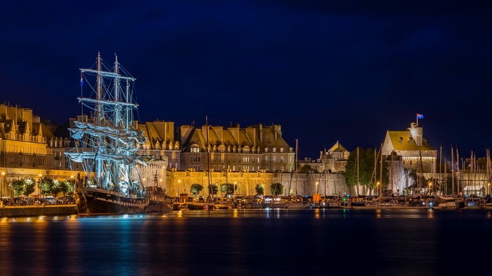Tall ship docked in Saint-Malo at night
