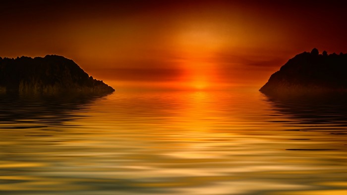Sunset over the ocean with islands