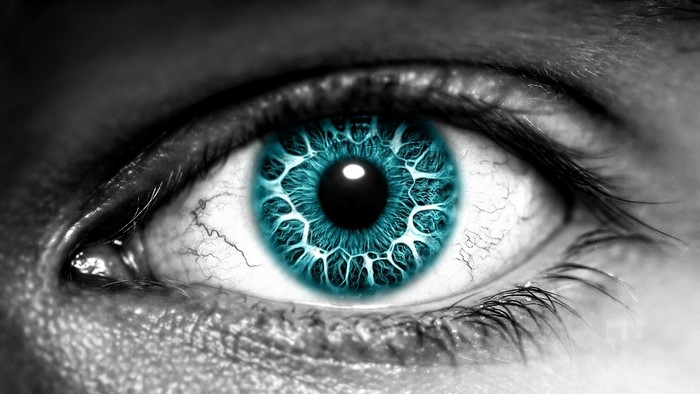 Close-up of a human eye with blue iris