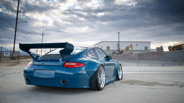 Blue Porsche 997 with large rear spoiler