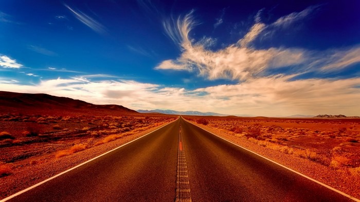 Desert road under a blue sky