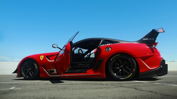 Red Ferrari 599XX race car with open door