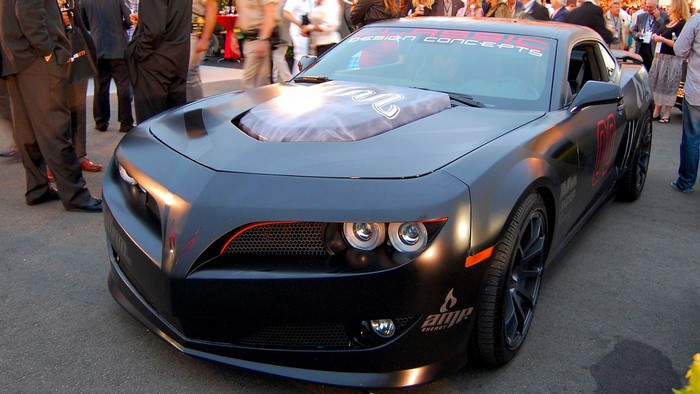 Custom black Chevrolet Camaro with "AMP Energy" branding