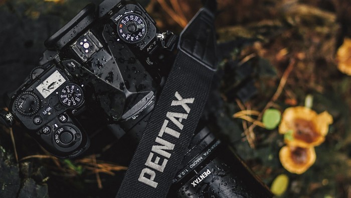 Pentax K-1 camera with lens and strap