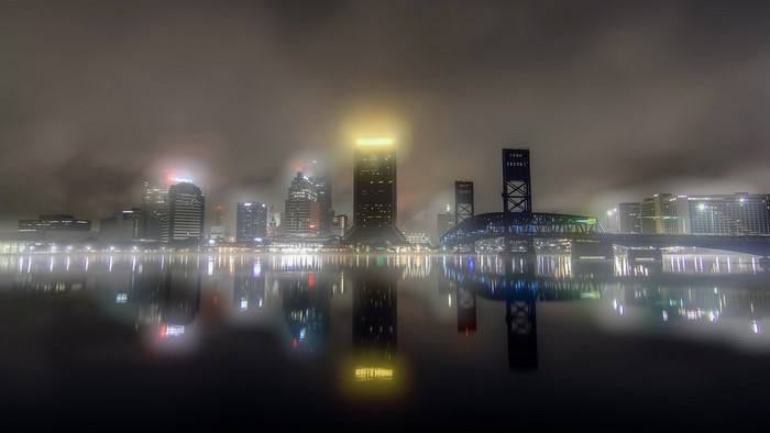 Jacksonville skyline at night with fog and reflections