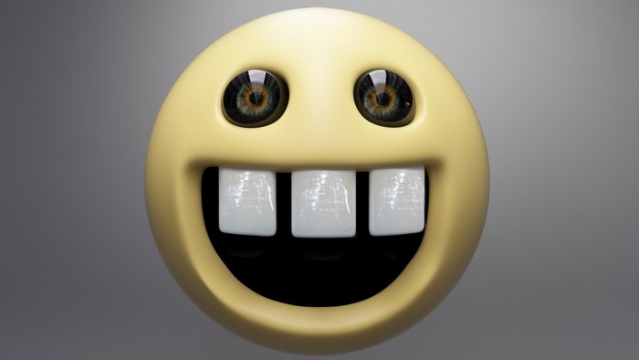 Goofy yellow smiley face with big eyes and teeth