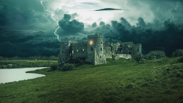 Castle ruins under a stormy sky with lightning
