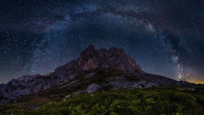 Milky Way over rocky mountain peak