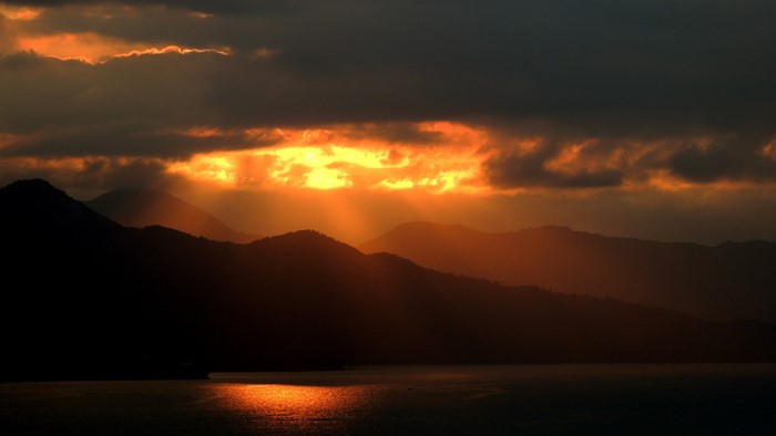 4K Sunset Over Mountains and Water