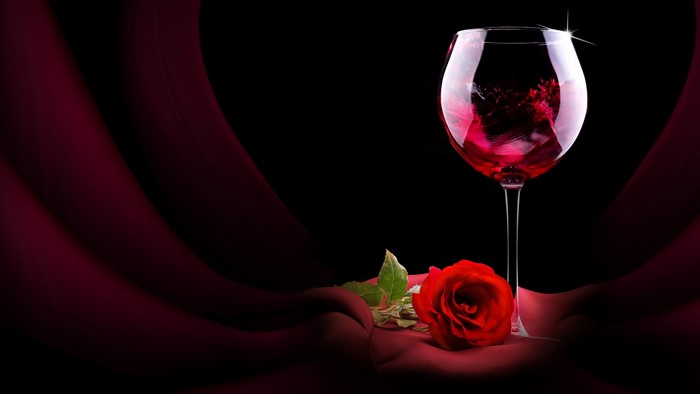 Red Rose and Wine Glass on Red Fabric