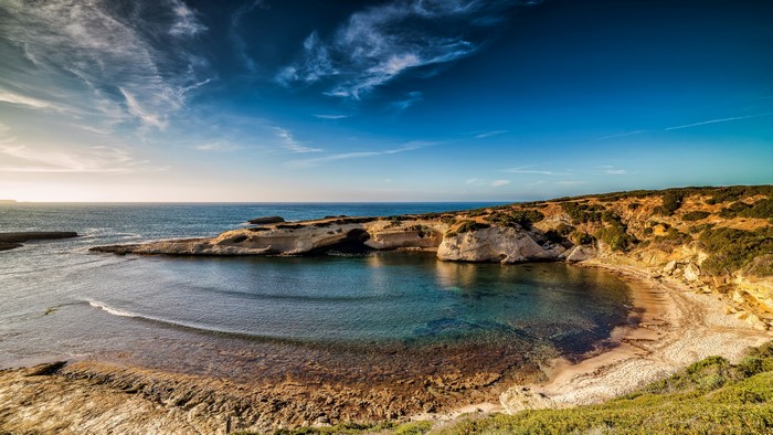 4K Coastline with Rocky Outcrops and Clear Water