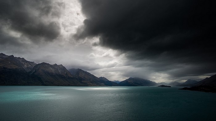 Dark Clouds Over Mountains and Lake