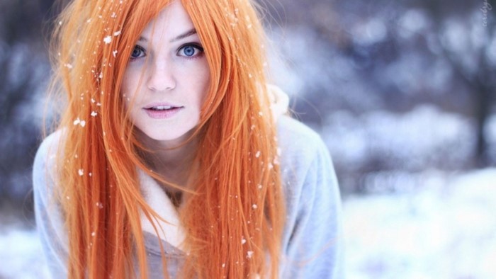 Girl with orange hair in the snow